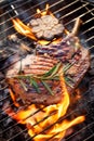 Grilled bone-in pork chop, pork steak, tomahawk in a rosemary-garlic marinade  on a flaming grill Royalty Free Stock Photo