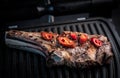 Grilled bone-in ribeye steak with chili