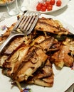 Grilled Bonito Palamut Fish Slices at dinner table.
