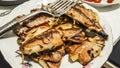 Grilled Bonito Palamut Fish Slices at dinner table.