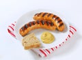 Grilled bratwursts with mustard Royalty Free Stock Photo