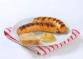 Grilled bratwursts with mustard Royalty Free Stock Photo