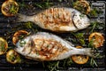 Grilled bream fish, dorada fish with the addition of spices, herbs and lemon on the grill barbecue