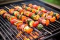 grilled brussels sprouts with bacon over a smoky grill