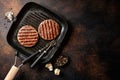 Grilled burger meat on grill pan Royalty Free Stock Photo