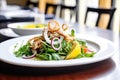 grilled calamari salad, mixed greens, red onion, lemon zest