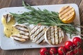 Grilled Camembert cheese with cherry tomatoes and rosemary Royalty Free Stock Photo