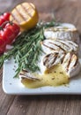 Grilled Camembert cheese with cherry tomatoes and rosemary Royalty Free Stock Photo