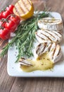 Grilled Camembert cheese with cherry tomatoes and rosemary Royalty Free Stock Photo