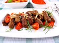 Grilled cevapcici with ajvar and giant white beans