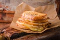 Grilled cheese sandwich with chili pepper on paper on wooden board. Selective focus. Royalty Free Stock Photo