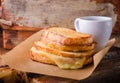 Grilled cheese sandwich on paper on wooden board. Selective focus. Royalty Free Stock Photo