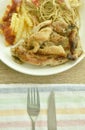 Grilled chicken black pepper steak dressing spicy sauce with French fries and fried spaghetti sausage on plate Royalty Free Stock Photo