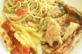 Grilled chicken black pepper steak dressing spicy sauce with French fries and fried spaghetti sausage on plate Royalty Free Stock Photo