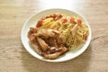 Grilled chicken black pepper steak dressing spicy sauce with French fries and fried spaghetti sausage on plate Royalty Free Stock Photo