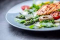 Grilled chicken breast asparagus arugula mushrooms tomatoes lemon and parmesan cheese. Royalty Free Stock Photo