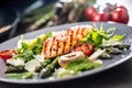 Grilled chicken breast asparagus arugula mushrooms tomatoes lemon and parmesan cheese. Royalty Free Stock Photo