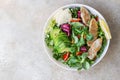 Grilled chicken breast, avocado, apple and bell pepper salad with salad leaves mix and olive oil and lemon dressing. Top view. Royalty Free Stock Photo