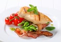 Grilled chicken breast with bacon-wrapped green beans