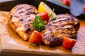 Grilled chicken breast in different variations with cherry tomat Royalty Free Stock Photo
