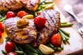 Grilled chicken breast in different variations with cherry tomat