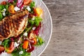 Grilled Chicken Breast fillet with fresh tomatoes vegetables salad. concept healthy food. Royalty Free Stock Photo