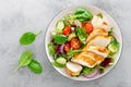 Grilled chicken breast, fillet and fresh vegetable salad of lettuce, arugula, spinach, cucumber and tomato. Healthy lunch menu. Di Royalty Free Stock Photo