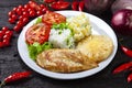 Grilled chicken breast fillet, rice, salad, potatoes pineapple slice