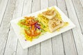 Grilled chicken breast fillets with french fries and salad of lettuce, sweet corn and tomato, carrot Royalty Free Stock Photo