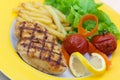 Grilled chicken breast with french fries ,baked to Royalty Free Stock Photo