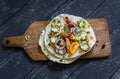 Grilled chicken breast, fresh vegetables - tomatoes, cucumbers, zucchini, onions, peppers and homemade tortilla