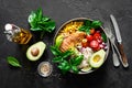 Grilled chicken breast lunch bowl with fresh tomato, avocado, corn, red onion, rice and basil Royalty Free Stock Photo