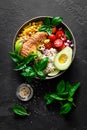 Grilled chicken breast lunch bowl with fresh tomato, avocado, corn, red onion, rice and basil Royalty Free Stock Photo