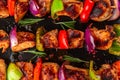 Grilled chicken breast meat barbecue skewers with vegetables. Shish kebab or shashlik. top view. close up Royalty Free Stock Photo