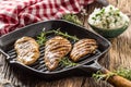 Grilled chicken breast on grilled pan with rice and green peas Royalty Free Stock Photo