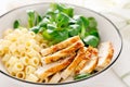 Grilled chicken breast, pasta and fresh lamb salad in lunch bow Royalty Free Stock Photo
