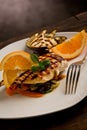 Grilled chicken breast on ratatouille bed