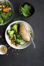 Grilled chicken breast, red rice and fresh broccoli vegetables, carrots, soybeans, spinach for garnish. With pine nuts Royalty Free Stock Photo