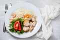 Grilled chicken breast with salad and boiled rice on white plate Royalty Free Stock Photo