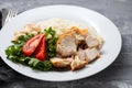 Grilled chicken breast with salad and boiled rice on white plate Royalty Free Stock Photo