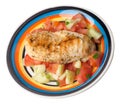 Grilled chicken breast salad with tomato, cucumber and onion .grilled chicken breast on a plate isolated on white background Royalty Free Stock Photo