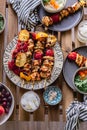 Grilled chicken breast and vegetables skewers. Barbeque summer time. Party dinner. Table setting. Bright and vibrant colors.