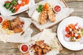 Grilled chicken breast and wings. Serving on a wooden Board on a rustic table. Barbecue restaurant menu, a series of Royalty Free Stock Photo