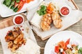 Grilled chicken breast and wings. Serving on a wooden Board on a rustic table. Barbecue restaurant menu, a series of Royalty Free Stock Photo