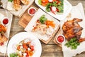 grilled chicken breast and wings. Serving on a wooden Board on a rustic table. Barbecue restaurant menu, a series of Royalty Free Stock Photo