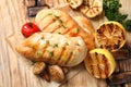 Grilled chicken breasts with garnish on wooden background Royalty Free Stock Photo