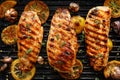 Grilled chicken breasts with thyme, garlic and lemon slices on a grill pan Royalty Free Stock Photo