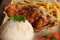 Grilled chicken breasts with thyme, garlic and lemon slices on a grill pan close up, top view Royalty Free Stock Photo