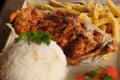 Grilled chicken breasts with thyme, garlic and lemon slices on a grill pan close up, top view Royalty Free Stock Photo