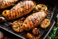 Grilled chicken breasts with thyme, garlic and lemon slices on a grill pan Royalty Free Stock Photo